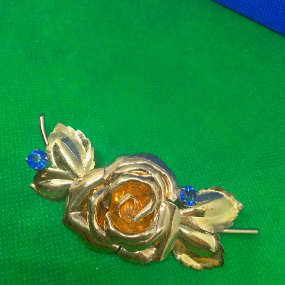 Dorsons rose brooch with Blue rhinestones